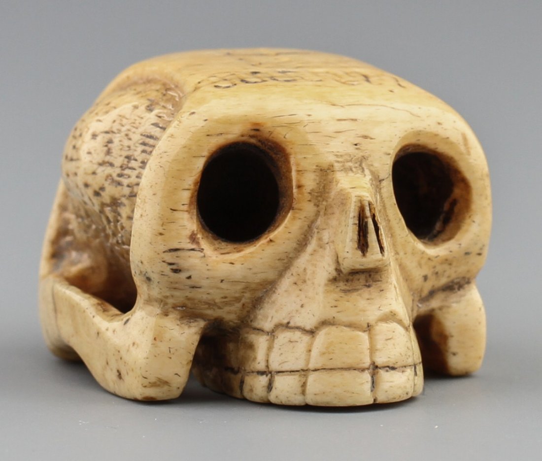 JAPANESE CARVED IVORY NETSUKE SKULL