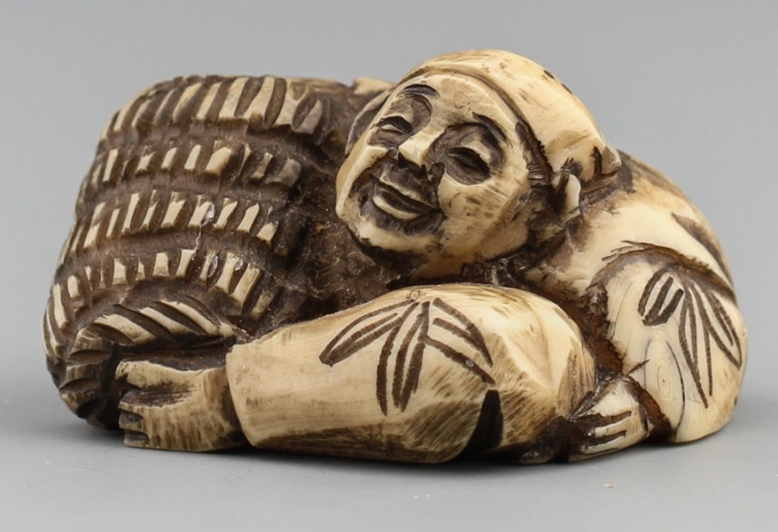 JAPANESE CARVED IVORY NETSUKE MAN & BASKET