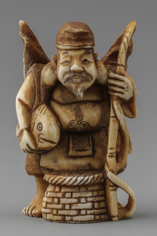 JAPANESE CARVED IVORY NETSUKE EBISU: JAPANESE CARVED IVORY NETSUKE EBISU Japanese carved ivory netsuke figure of Ebisu. Signature on bottom. Size: 2 x 1.5 x 1" Weight: 31g