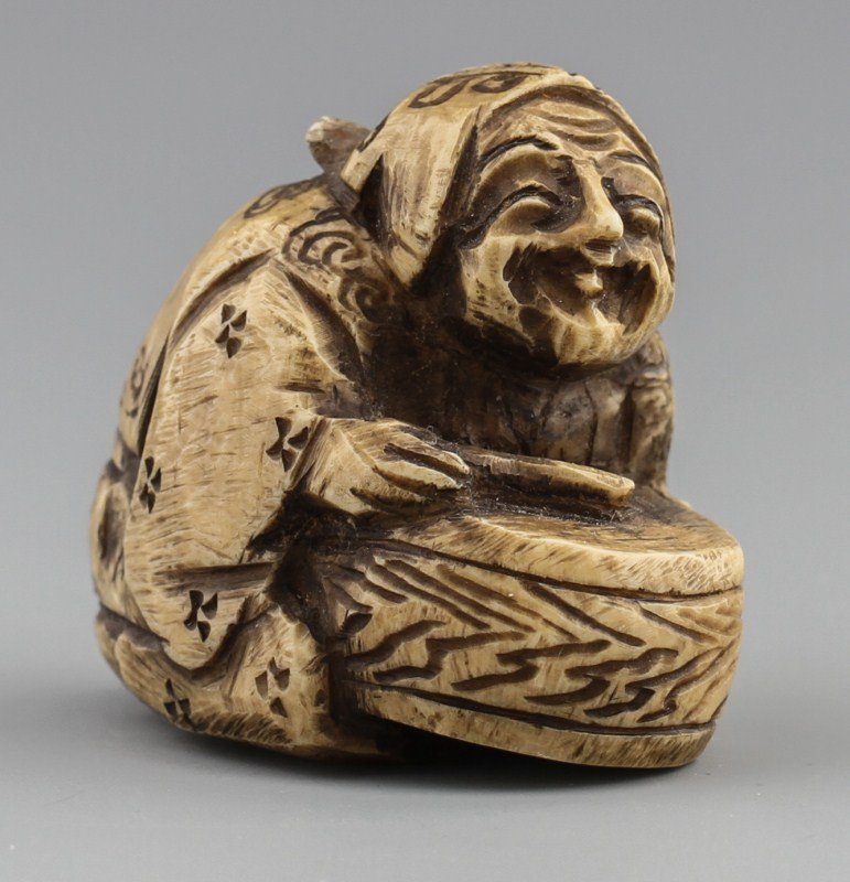 JAPANESE CARVED IVORY NETSUKE WOMAN WITH DISH