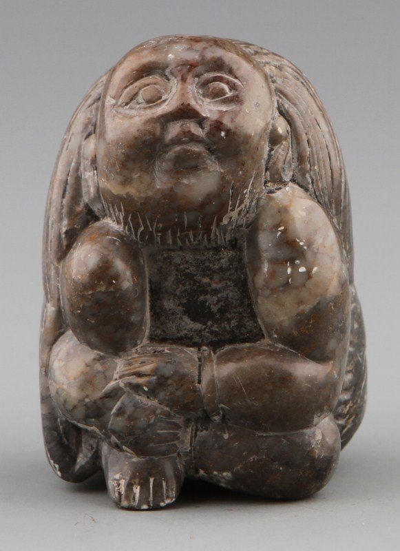 JAPANESE CARVED STONE NETSUKE WOMAN: JAPANESE CARVED STONE NETSUKE WOMAN Japanese carved stone netsuke of a woman dressed in her kimono in the sitting position. Signed Size: 1.75 x 1.375"