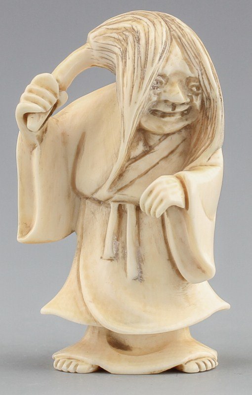 JAPANESE CARVED IVORY NETSUKE BALD ELDER W/ MOP: JAPANESE CARVED IVORY NETSUKE BALD ELDER W/ MOP Japanese carved ivory netsuke figure of a bald elder jocularly wearing a long hair mop, Signed Seiho. Size: 1.75" Weight: 16g
