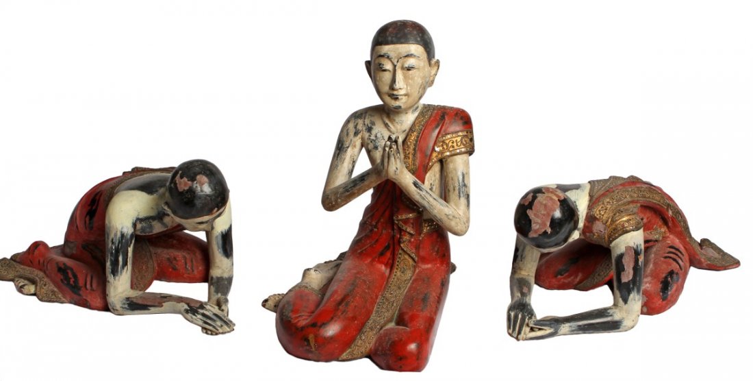 (3) CARVED MONK TEMPLE STATUES THAILAND: (3) CARVED MONK TEMPLE STATUES THAILAND Three carved wooden monk figures in prayer, two bowing (30 x 21 x 16") and one seated (24 x 16 x 26"). Overall good condition with wear appropriate with age.
