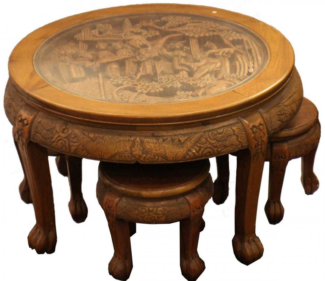 Chinese oval coffee table with hand-carved king in palace scene and six ASIAN HAND CARVED COFFEE TABLE W/ 4 STOOLS