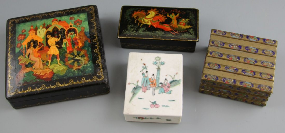(4) DECORATIVE BOXES CHINA RUSSIA: (4) DECORATIVE BOXES CHINA RUSSIA A lot of four decorative dresser boxes. Two Russian lacquer boxes, 6 x 6 x 1.5", 5 x 2.5 x 1.25" both with figural imagery. Two Chinese boxes. Chinese porcelain box,