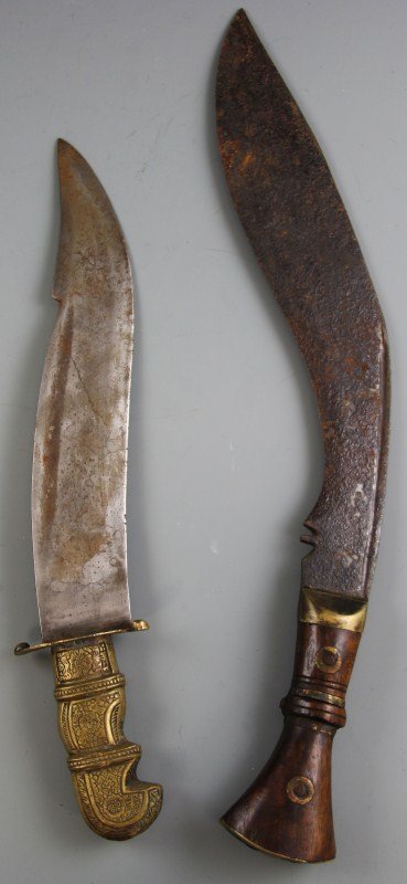 (2) SOUTH ASIAN KNIVES: (2) SOUTH ASIAN KNIVES Lot of two knives; Nepalese kukri knife and Indian brass handle knife, circa 1900's. Size: 18.5" and 15"