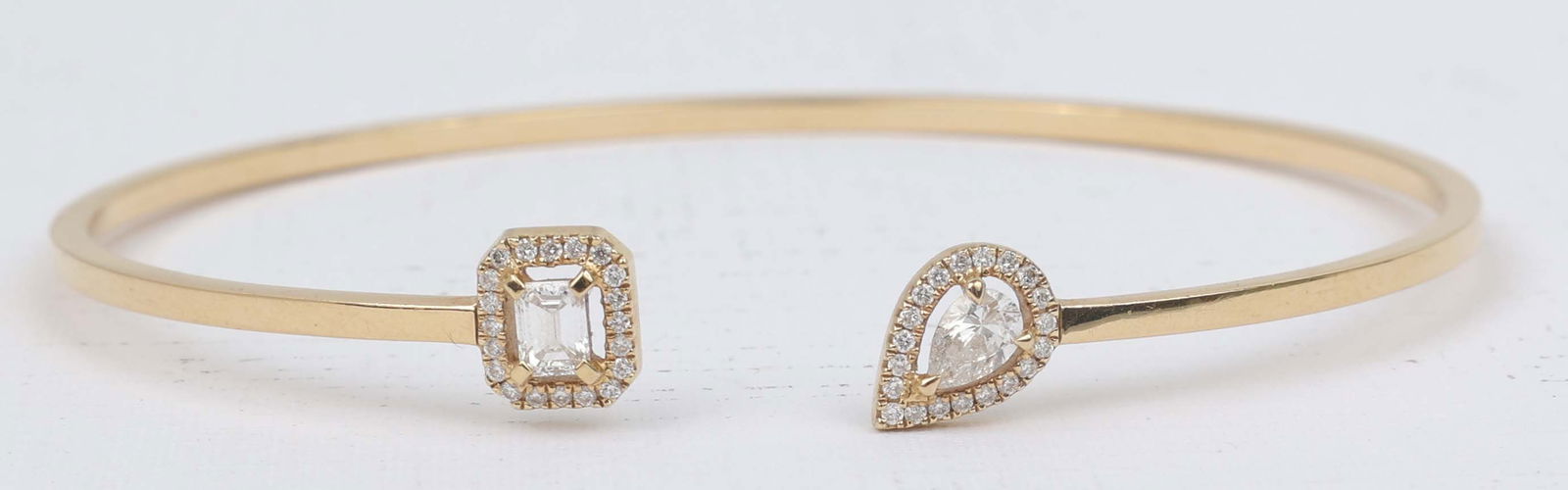 18K MY TWIN TOI & MOI MESSIKA DIAMOND THIN BANGLE: 18k Yellow Gold. Central stone weight : 0.15 ct each, quality F/VS Diamond total weight : 0.40 ct, quality FG/VS Size S (5.7-5.9 inches) 3.8 Grams Must be paid by Certified Check, money order, or wire