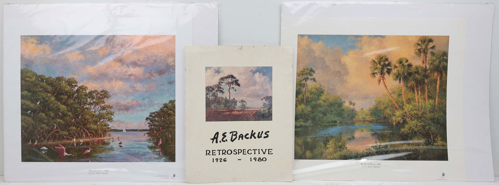 LOT OF 2 A.E.BACKUS PRINTS & RETROSPECTIVE POSTER: Backus, Albert Ernest "Beanie" (1906 - 1990) Indian River School, founder of the Highwaymen movement - Florida Hall of Fame Artist. Lot includes two lithographs "St Lucie River - 1996" & "Mangroves -