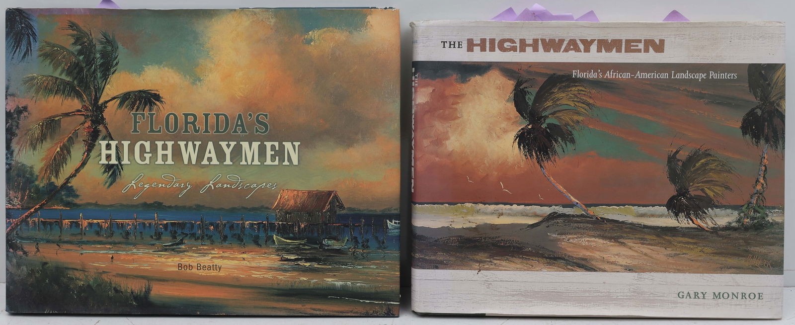 2 HIGHWAYMEN BOOKS WITH SIGNATURES: 1. The Highwaymen By Gary Monroe - Autographed by 4 Highwaymen Artists. Al Black - 1 signature, James Gibson - 3 signatures, R.A. McLendon - 3 signatures, and Mary Ann Carroll - 4 signatures. 2.