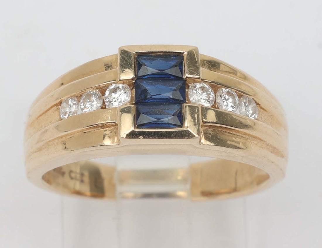 14K MENS SAPPHIRE & DIAMOND RING: 14k Yellow Gold Men's Sapphire and Diamond Ring. six accent diamonds totaling .22 ct and three blue sapphires totaling .75 ct. Size: 8 Weight: 5.5 grams Must be paid by Certified Check, money