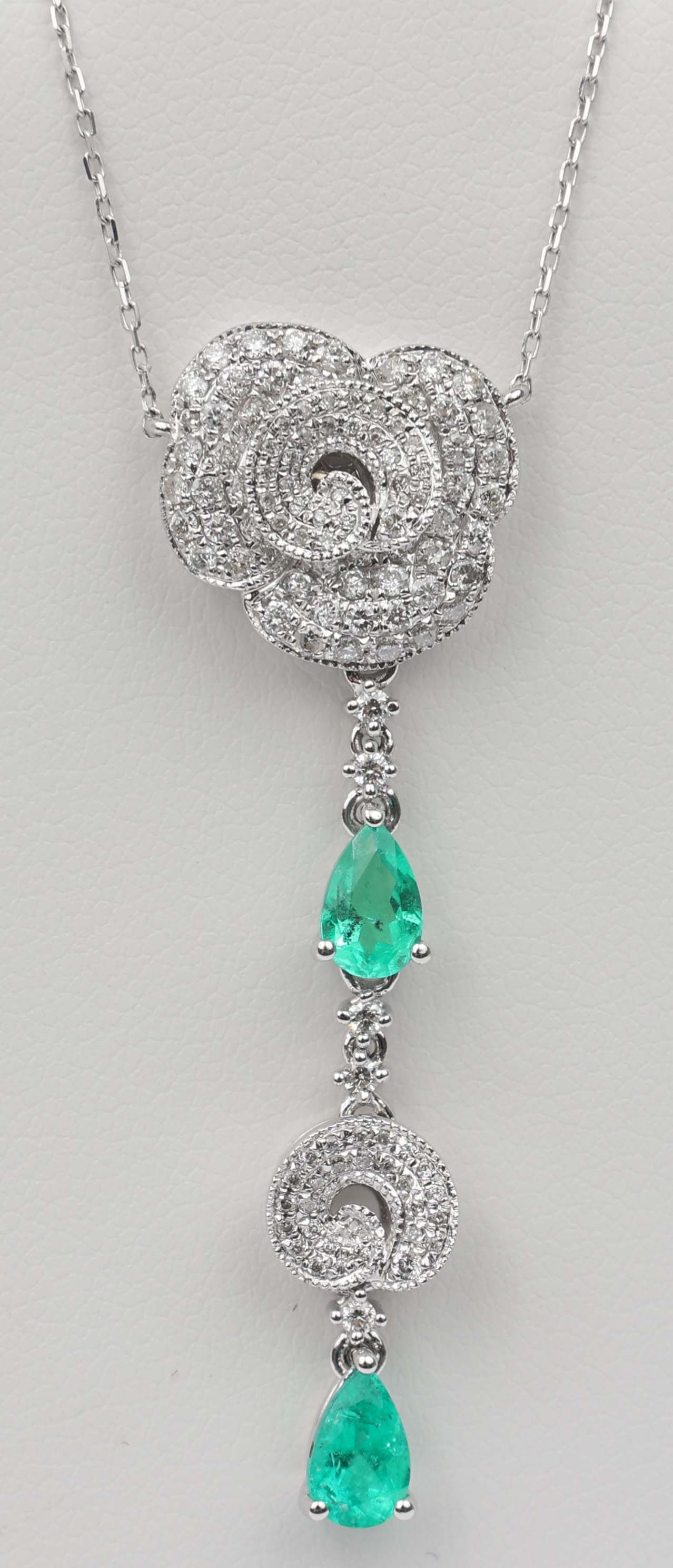 14K MICHAEL CHRISTOFF NECKLACE DIAMOND & EMERALD: 14k Michael Christoff White Gold Necklace Diamond & Emerald. One hundred and eighteen round diamonds totaling .55 ct. and two emeralds totaling .68 ct. Size / Length: 16" Weight: 4.6 grams 