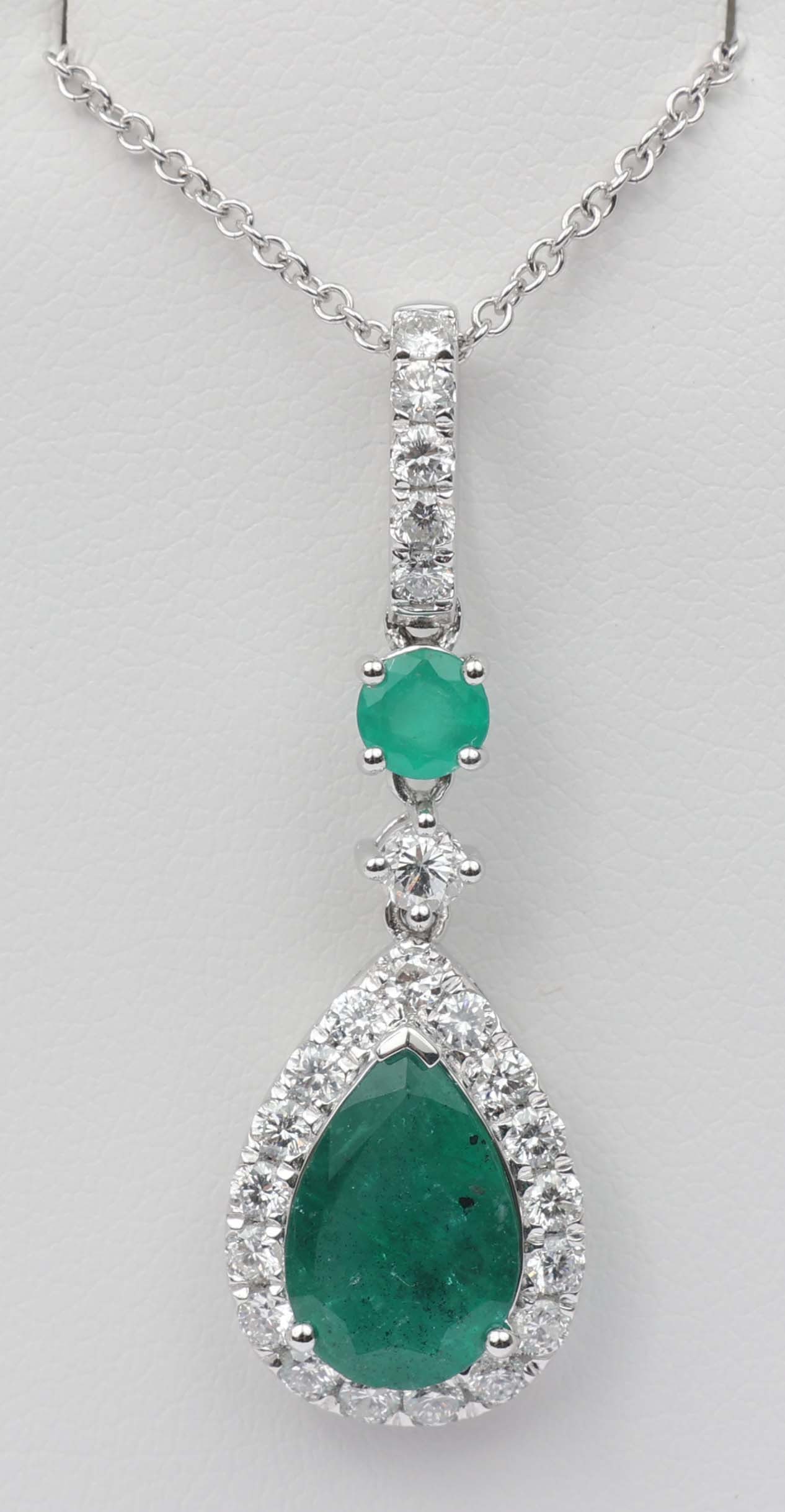 18K MICHAEL CHRISTOFF PENDANT DIAMOND & EMERALD: 18k Michael Christoff White Gold Pendant Diamond and Emerald. twenty three round diamonds totaling .72 ct and two emeralds totaling 2.13 CT Length: 16" Chain Weight: 4.7 grams Must be paid