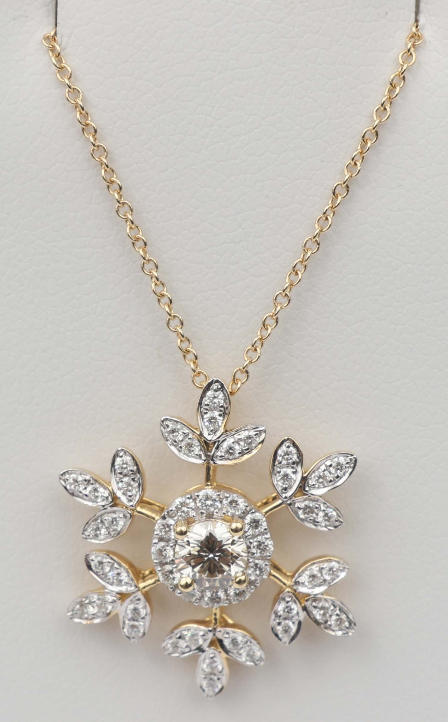 18K DIAMOND SNOWFLAKE PENDANT: 18k Yellow Gold Snowflake Pendant Diamond. 48 round diamonds .33 ct. and one fancy center diamond. .30 ct. Size / Length: 16" Weight: 3.5 grams Must be paid by Certified Check, money order, 
