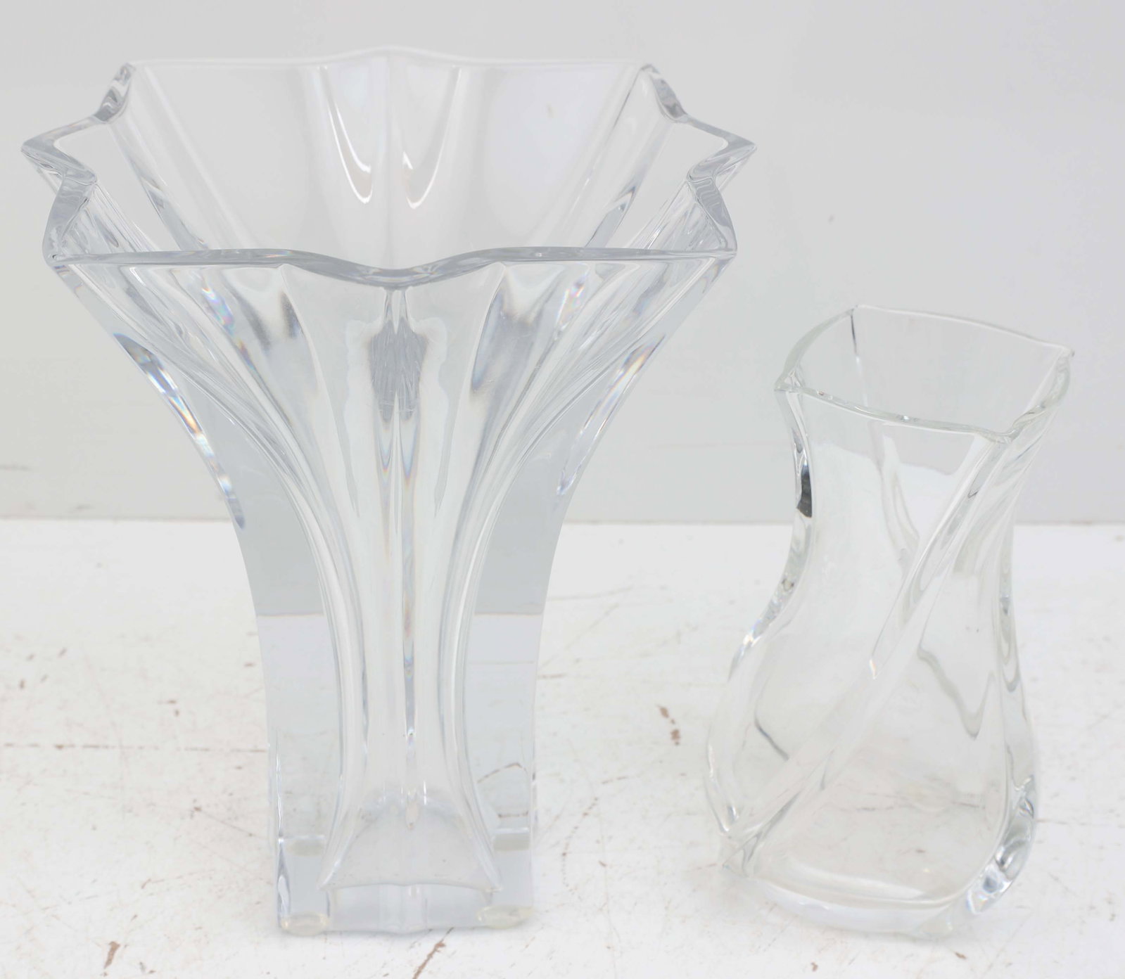 BACCARAT LOT OF 2 VASES SERPENTIN & BOUQUET: Maker: Baccarat Pattern: Serpentin Height: 6 inches Markings: Acid-etched Baccarat hallmark to base Pattern: Bouquet Height: 8 inches Markings: Acid-etched Baccarat hallmark to base *Local Pickup or T
