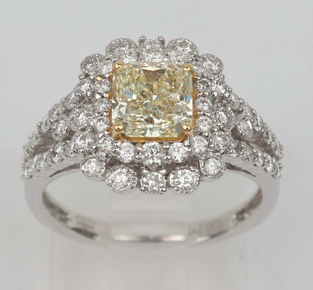 18K FANCY YELLOW DIAMOND RING MICHAEL CHRISTOFF: Michael Christoff 18K White Gold Ring Featuring a Yellow Diamond and White Diamonds. Fancy Yellow Diamond 1.33 ct radiant cut VVS clarity with .76 ct in accent diamonds. Size: 6.5 Weight: 4.7 G Must b