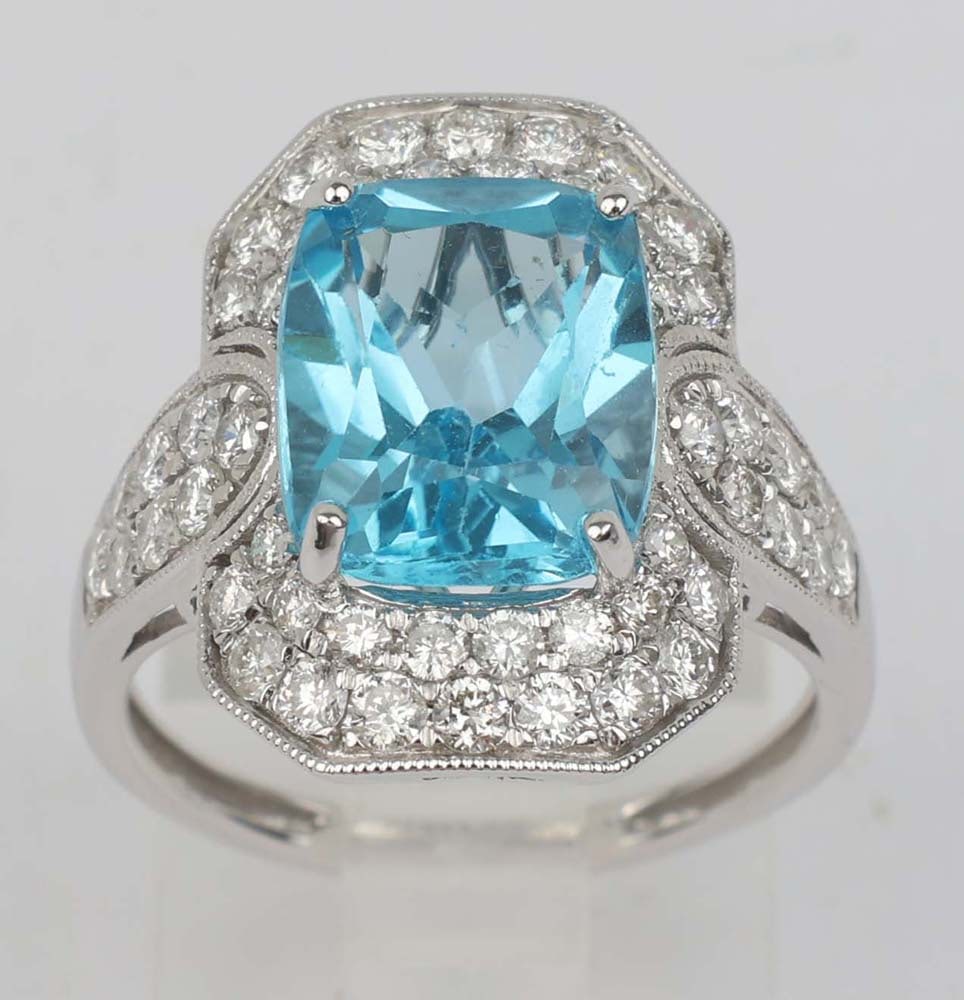 14K BLUE TOPAZ DIAMOND RING MICHAEL CHRISTOFF: Michael Christoff 14K White Gold Ring Featuring a large Blue Topaz and Diamonds. 9x11 mm, 5.15 ct surrounded by 50 brilliant round diamonds 1.04 ct. Size: 6.5 Weight: 4.4 G Must be paid by Certified