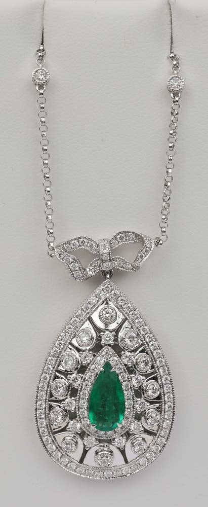 18K EMERALD DIAMOND NECKLACE MICHAEL CHRISTOFF: Michael Christoff 18K White Gold Emerald and Diamond Necklace. 7x12mm, 1.05 ct. accented by 1.88 ct of brilliant round diamonds. H Vs quality. Length: 16" chain. Pendant 1.5" Weight: 12.5 G Must be