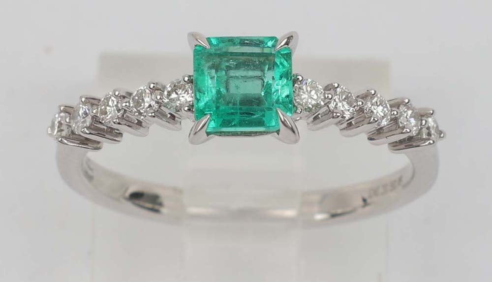 18K EMERALD DIAMOND RING MICHAEL CHRISTOFF: Michael Christoff 18K White Gold Ring Featuring Emerald and Diamonds. Emerald cut, .61 ct. ten brilliant round diamonds .20 ct total H color Vs clarity. Size: 6.25 Weight: 2.2 G Must be paid by Certif