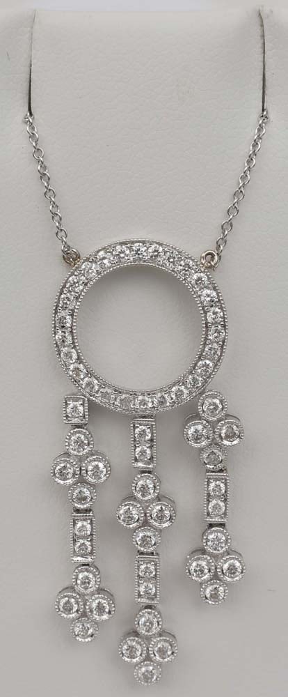 18K WHITE GOLD DIAMOND PENDANT: 18K White Gold Diamond Pendant. Brilliant rounds .95ct. Length: 16" chain. Pendant 1.75" Weight: 5.3 G Must be paid by Certified Check, money order, or wire transfer ($15 fee). NO CREDIT OR PERSONAL C