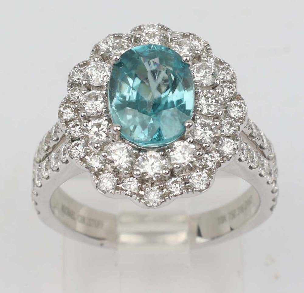 14K BLUE ZIRCONIA DIAMOND RING MICHAEL CHRISTOFF: Michael Christoff 14K White Gold Ring Featuring a large Blue Zirconia and Diamonds. 3.16 ct Blue Zirconia 7.5x5.3 mm accented by sixty eight round diamonds totaling 1.62 ct. Size: 7 Weight: 7.7 G Must