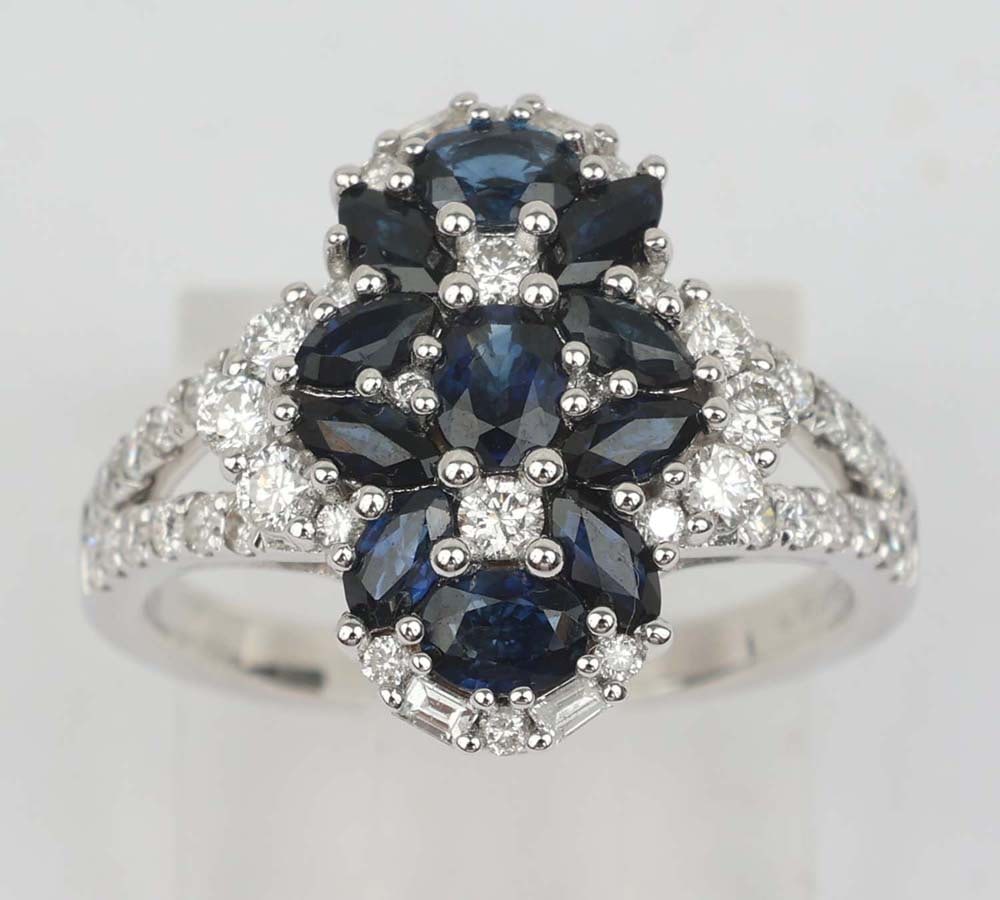 18K SAPPHIRE DIAMOND RING MICHAEL CHRISTOFF: Michael Christoff 18K White Gold Ring Featuring Blue Sapphires and Diamonds. Sapphire 1.39 ct, accented by .66 ct of baguette and round diamonds. Size: 6.5 Weight: 5.1 G Must be paid by Certified Chec