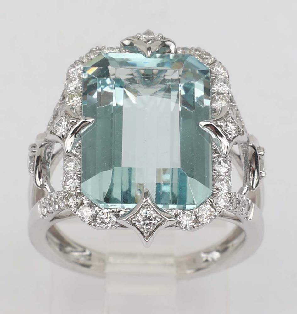 14K AQUAMARINE DIAMOND RING MICHAEL CHRISTOFF: Michael Christoff 14K White Gold Ring Featuring a large Aquamarine and Diamonds. Brilliant 6.73 ct. Step cut Aqua 11x16mm surrounded by 42 brilliant round diamonds .65 ct H color Vs quality Size: 6.5 