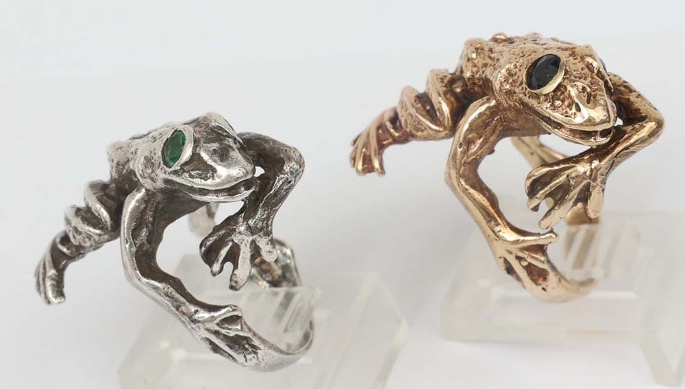 10K YELLOW GOLD & STERLING FROG RING DUO: 10K yellow gold Frog Motif Ring with onyx eyes. Size 7.5 properly marked. 16.5 grams Sterling Silver Frog Motif Ring with Emerald eyes. Size 7. 13 grams Must be paid by Certified Check, money order, o