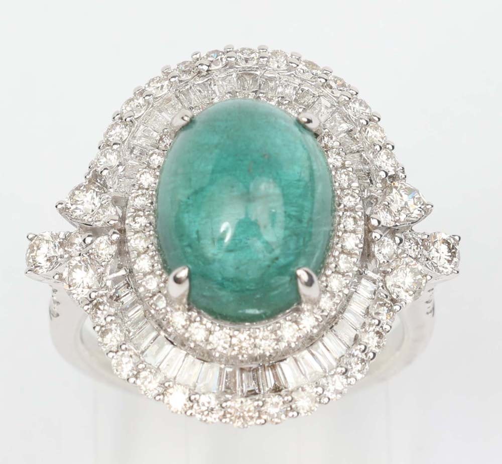 18K WHITE GOLD CABOCHON EMERALD & DIAMOND RING: 18K White gold Emerald and Diamond ring Gemstones: Diamond and Emerald 1.19 ct baguette & round diamonds. F -Vs, SI Clarity1 Cabochon Emerald 4.36ct. Size 6 Weight: 4.5 grams plus gem weight. Overall
