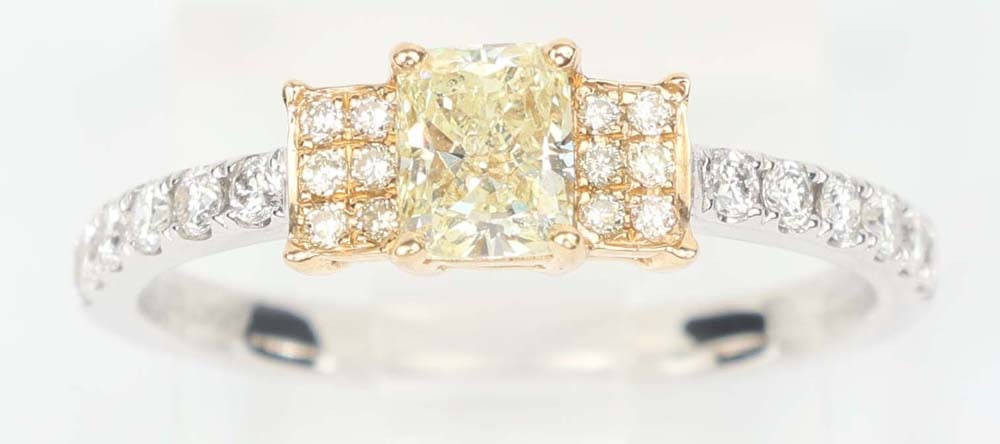 18K WHITE GOLD DESIGNER FANCY YELLOW DIAMOND RING: 18K White gold Fancy yellow and white Diamond ring Exceptional Michael Christoff quality. Gemstones: Diamond and Fancy yellow diamonds..46 ct Radiant cut diamond . Fancy light / Vs2 24 round diamonds