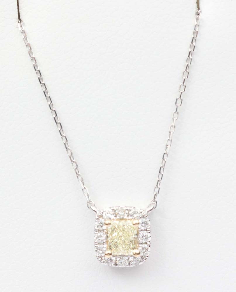 18K WHITE GOLD FANCY YELLOW DIAMOND NECKLACE: 18K White gold Fancy Yellow Diamond pendant Exceptional Michael Christoff design quality. Gemstones: Diamond and Fancy Yellow Diamond. 1 Radiant cut Fancy Yellow diamond .26ct ct SI1 12 round
