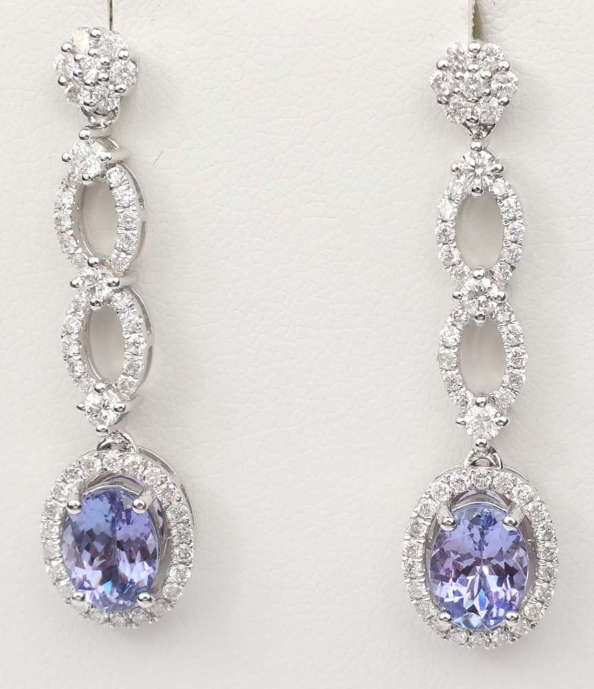 14K WHITE GOLD DIAMOND TANZANITE DANGLE EARRINGS: 14K White gold Tanzanite and Diamond Earrings Gemstones: Diamond and Tanzanite 1.03ct round diamonds G Color-VS Clarity 2 Tanzanite 2.21 ct. Weight: 4.7 grams plus gem weight. Overall dimensions: