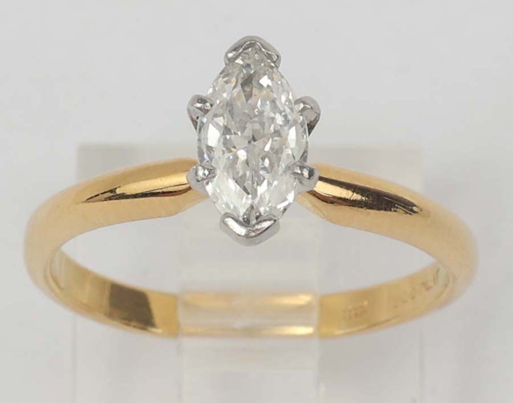 18K GOLD PLATINUM DIAMOND MARQUISE SOLITAIRE RING: 18K & Platinum Marquise diamond solitaire ring 7.96 x 4.44 x 2.48mm estimated weight .50 ct. G color Vs2 clarity accompanied by a GIA accredited gemologist certificate. Size: 6.5 Weight: 3.1 grams Mus