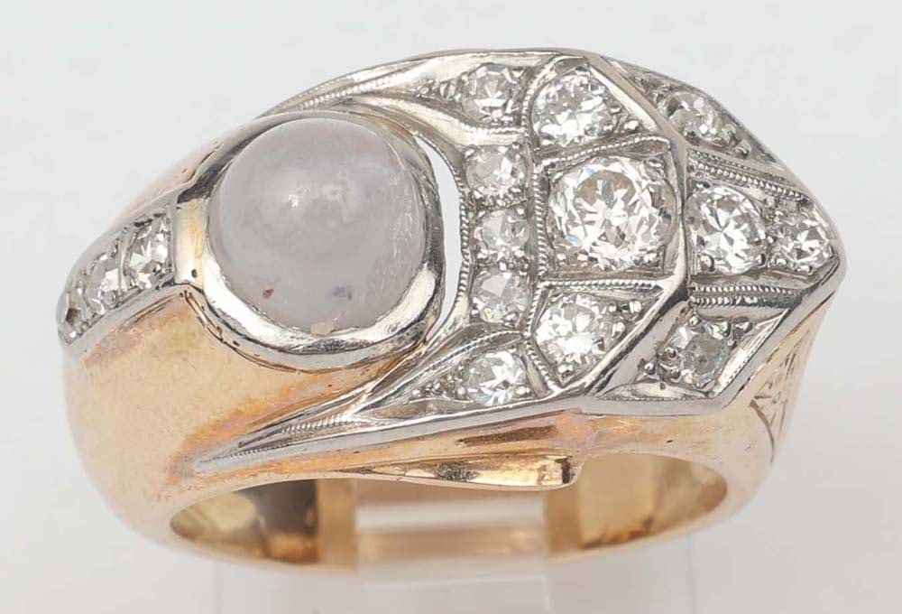 10K GOLD TWO TONE STAR SAPPHIRE & DIAMOND RING: 10K two tone 5mm cabochon cut, star sapphire and diamond ring. .60 ct European cut diamonds. 7mm high dome cab, Size: 7 Weight: 11.1 grams Must be paid by Certified Check, money order, or wire