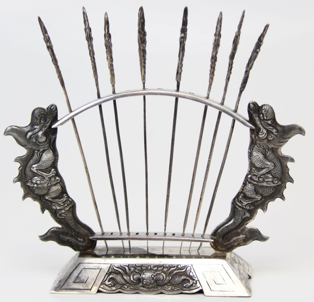RUSSIAN SILVER HAIR STICK PIN HOLDER: RUSSIAN SILVER HAIR STICK PIN HOLDER Russian .875 silver hair stick/pin holder, depicting Vietnamese dragon motif on both stand and pin tops. Pins are marked "M (for Moscow) [hammer and sickle] 875" u