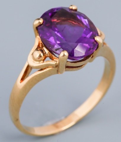 18K YELLOW GOLD AMETHYST RING: 18K YELLOW GOLD AMETHYST RING Ladies 18K yellow gold fashion setting with a 3.5ct oval cut amethyst. Amethyst has a beautiful, rich, violet color. Weight: 4 g Size: 7