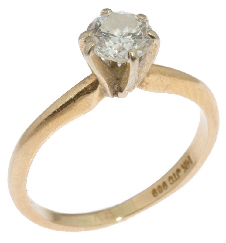 LADIES 14K GOLD DIAMOND SOLITAIRE ENGAGEMENT RING: LADIES 14K GOLD DIAMOND SOLITAIRE ENGAGEMENT RING Ladies solitaire engagement ring. Approximately a 0.55 ct round cut diamond of SI clarity and H-I color. 14K yellow gold band with white gold prongs. 