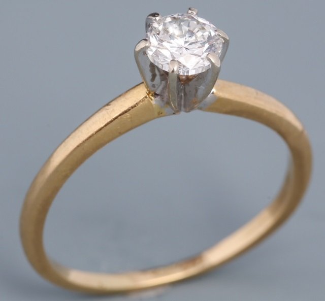 LADIES 14K YELLOW GOLD DIAMOND SOLITAIRE: LADIES 14K YELLOW GOLD DIAMOND SOLITAIRE Ladies 14K yellow gold, six prong setting with a .56 ct round cut diamond H, I1.. Weight: 2 g Size: 6
