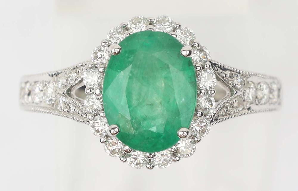 14K WHITE GOLD EMERALD & DIAMOND RING: 14k white gold Emerald & Diamond Ring. Designer Michael Christoff. Gemstones: Emerald & Diamond 60 round diamonds .73 ct.One Columbian Emerald 1.57 ct. 14k white gold Size: 6.5 Weight: 3.8 grams