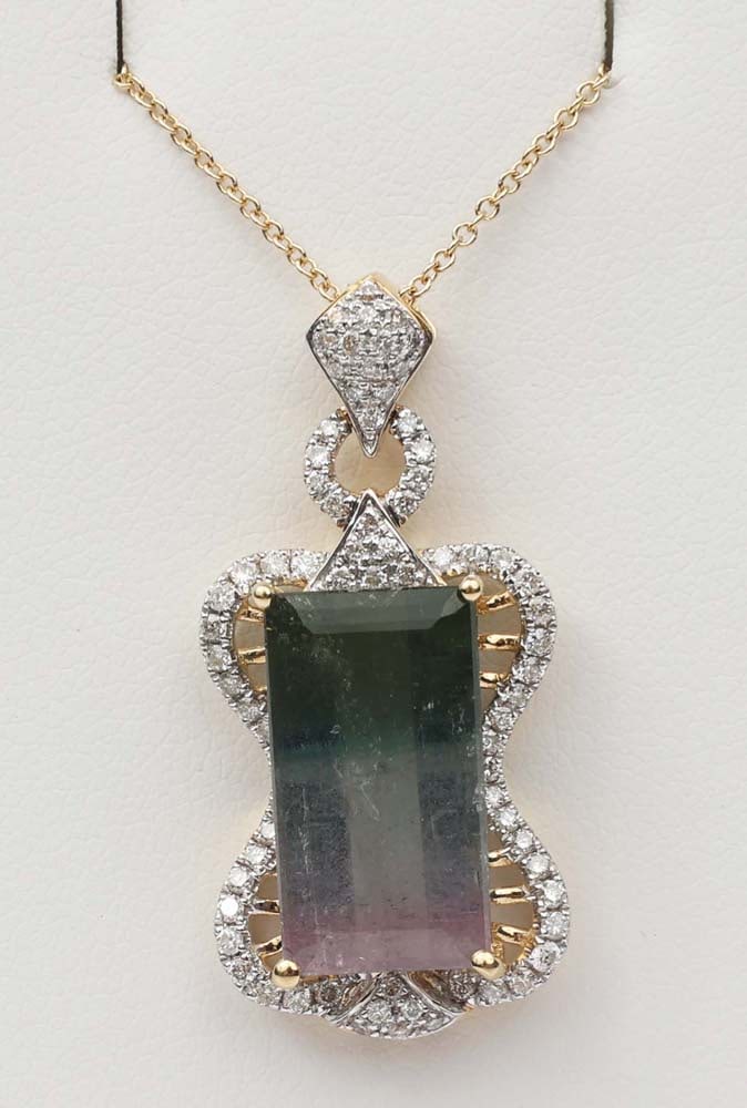 18K YELLOW GOLD TOURMALINE & DIAMOND PENDANT: 18k yellow gold Tourmaline & Diamond Pendant. Gemstones: Tourmaline & Diamond 76 round diamonds .49 ct. One Bi Color tourmaline rose and green 7.74ct 18k yellow gold Length: 18" Weight: 6.5 grams