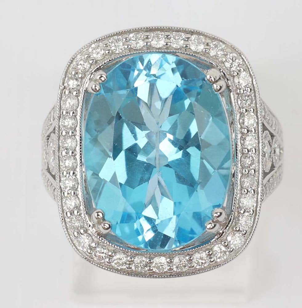 18K WHITE GOLD BLUE TOPAZ & DIAMOND RING: 18k white gold Blue Topaz & Diamond Ring. Designer Michael Christoff. Gemstones: Blue Topaz & Diamond 118 round diamonds totaling 1.1ct.Blue topaz center 10.42 ct. 18K white gold with exquisite bead