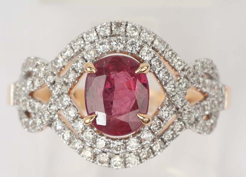 18K ROSE GOLD RUBY & DIAMOND RING: 18k rose gold Ruby & Diamond Ring. Gemstones: Ruby & Diamond 84 round diamonds totaling.54 ct One Very fine center ruby 1.12 ct.18K Rose gold Size: 6.75 Weight: 3.8 Overall dimensions:13x18mm Note: