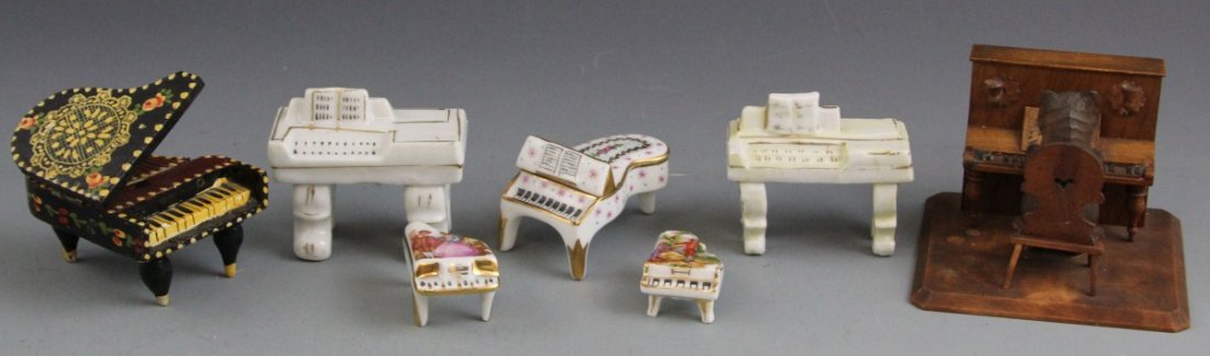 (7) MINIATURE PIANOS: (7) MINIATURE PIANOS A lot of seven miniature pianos, mostly porcelain. Makers include Limoges and Japan. Also included is mixed media black piano and wooden piano being played by bear.