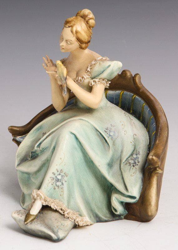 EARLY BORSATO INTERLUDE SIGNED FIGURE: EARLY BORSATO INTERLUDE SIGNED FIGURE Early Porcelain figure by Antonio Borsato, made in Italy. Interlude, #469. Young lady in a formal dress seated in a Victorian settee admiring a small parakeet. Fi