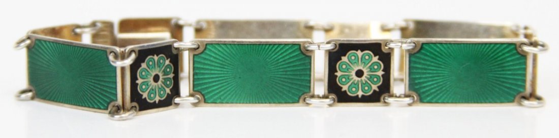 DAVID ANDERSEN NORWEGIAN GUILLOCHE ENAMEL BRACELET: DAVID ANDERSEN NORWEGIAN GUILLOCHE ENAMEL BRACELET Sterling silver link bracelet by Norwegian silversmith David Anderson of Oslo. Green and black with floral motif. Weight: 16.1g Size: 6.25"
