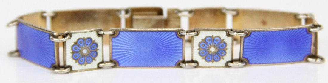 DAVID ANDERSEN NORWEGIAN GUILLOCHE ENAMEL BRACELET: DAVID ANDERSEN NORWEGIAN GUILLOCHE ENAMEL BRACELET Sterling silver link bracelet by Norwegian silversmith David Anderson of Oslo. Blue and white with floral motif. Weight: 16.5g Size: 6.75"