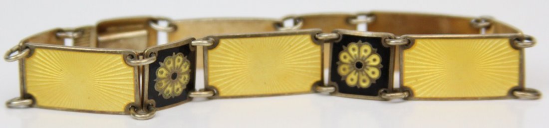 DAVID ANDERSEN NORWEGIAN GUILLOCHE ENAMEL BRACELET: DAVID ANDERSEN NORWEGIAN GUILLOCHE ENAMEL BRACELET Sterling silver link bracelet by Norwegian silversmith David Anderson of Oslo. Yellow and black with floral motif. Weight: 16.9g Size: 6.75"
