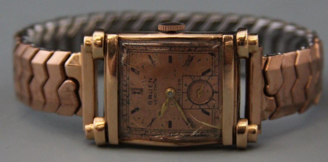 GRUEN 14K ROSE GOLD VERI-THIN PRECISION WRISTWATCH: GRUEN 14K ROSE GOLD VERI-THIN PRECISION WRISTWATCH Men's manual Gruen Veri-Thin 17 jewel Precision wristwatch, Case # 131258, 14K rose gold case, stainless steel Speidel band. Copper tone dial, gold t