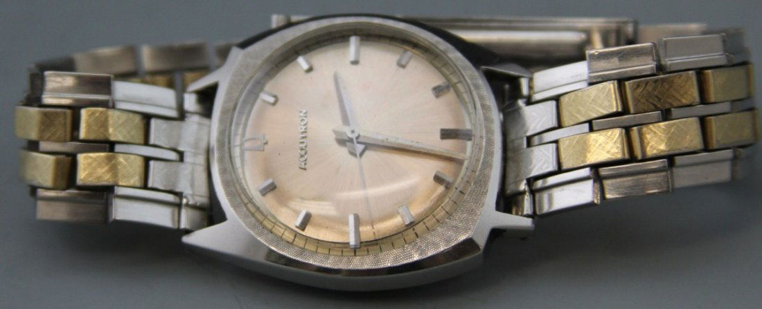 BULOVA 1965 ACCUTRON MEN'S WRIST WATCH: BULOVA 1965 ACCUTRON MEN'S WRIST WATCH Men's 1965 Bulova Accutron waterproof wrist watch, stainless steel bezel and band, 10K gold foil caps, Case # D87532. Silver tone hands and baton numbers. Workin