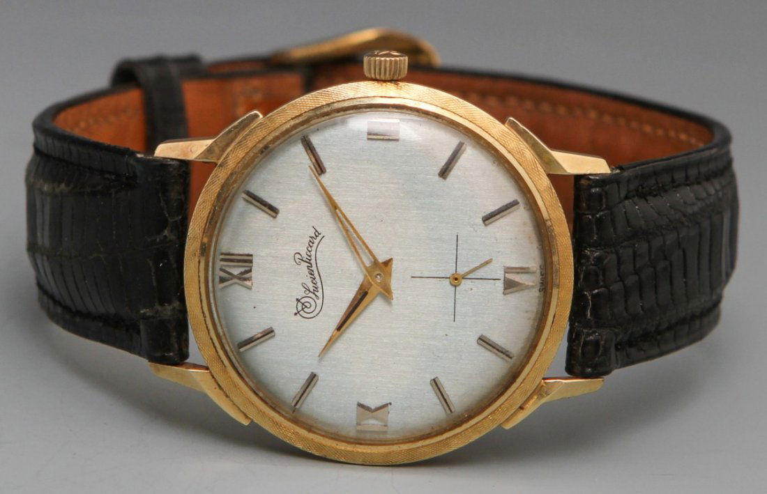 14K LUCIEN PICCARD MANUAL WRISTWATCH: 14K LUCIEN PICCARD MANUAL WRISTWATCH Lucien Piccard Manual Wristwatch, 14K yellow gold case no.107100, silver toned baton numerals, gold toned hour and minute hand and second hand at the 6 position, b