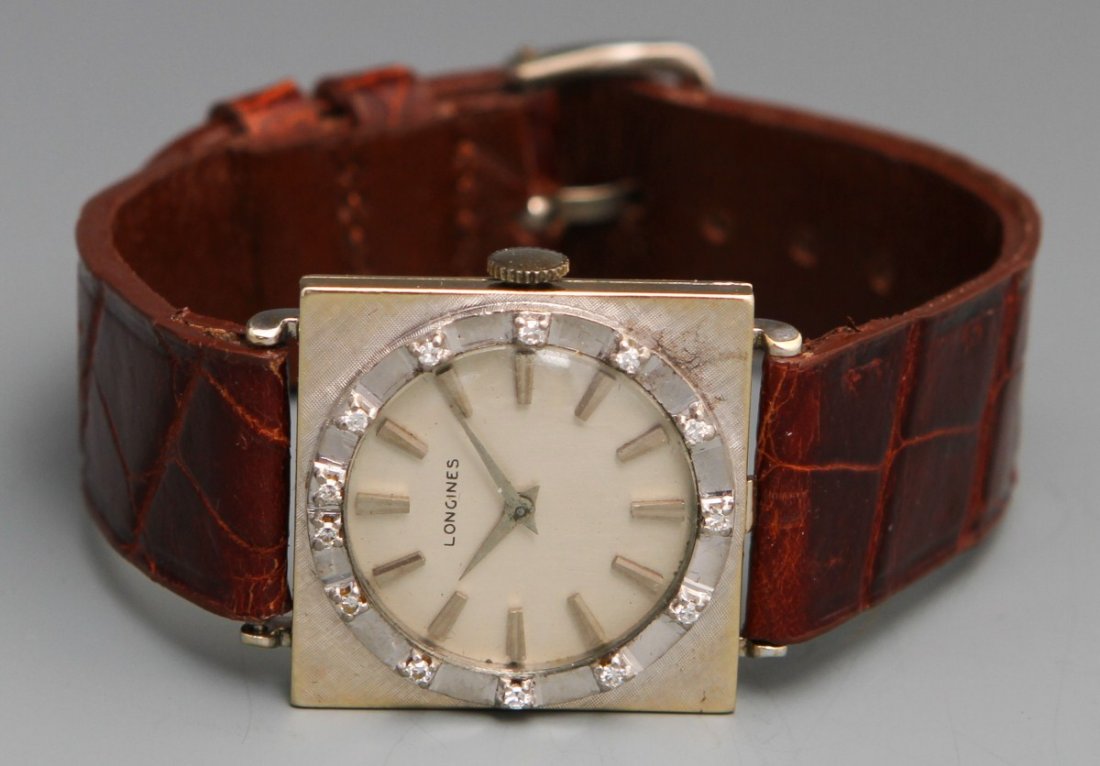 18K LONGINES 1965 DIAMOND MANUAL WRISTWATCH: 18K LONGINES 1965 DIAMOND MANUAL WRISTWATCH Longines men's 1965 diamond manual wristwatch, 17 jewel unadjusted 19.4 movement, 18K white gold case no. 694395, serial no. 12959202, silver toned baton nu